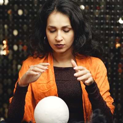 performing a psychic reading with a crystal ball